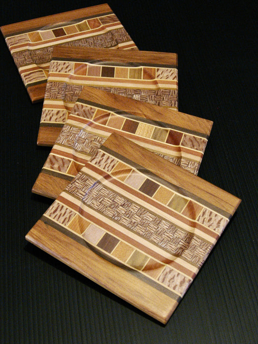 Set of Four Coasters showing many NZ Native Timbers with rimu wood border by Timber Arts Silver Fern Gallery