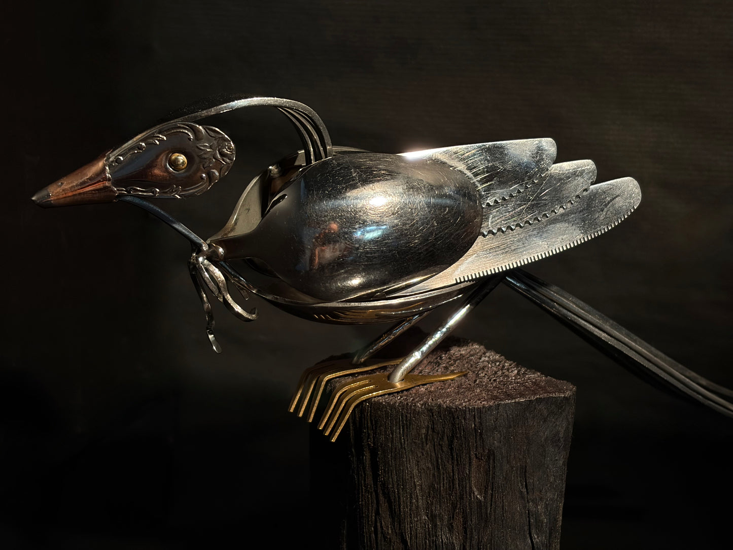 Metallic New Zealand tui bird sculpture.