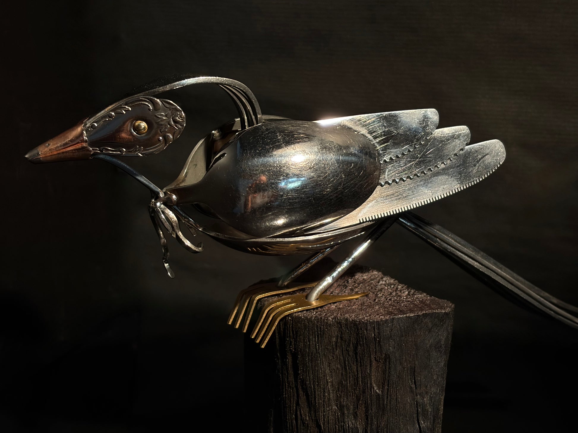 Metallic New Zealand tui bird sculpture.