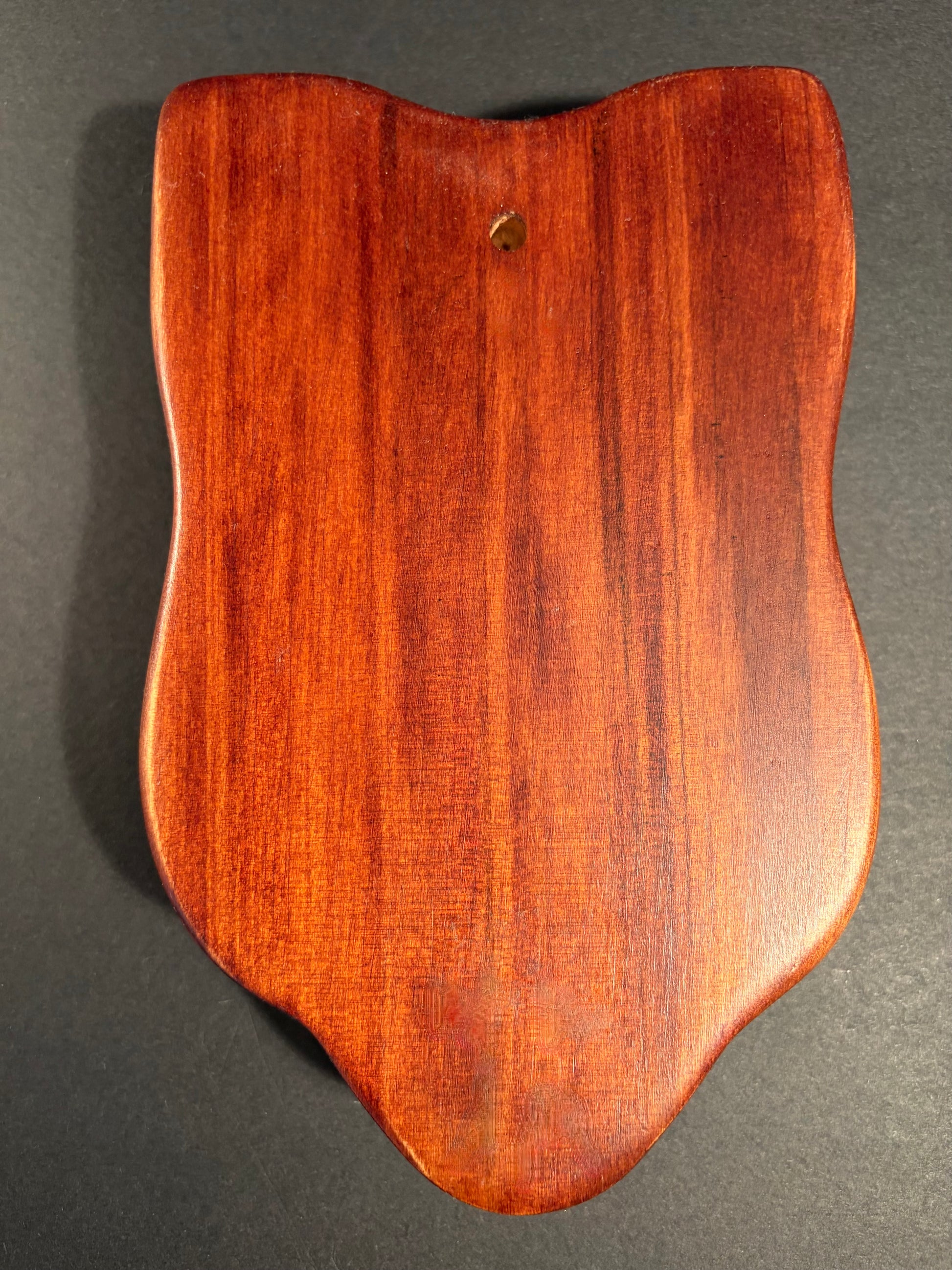 showing reverse side of maori mask 