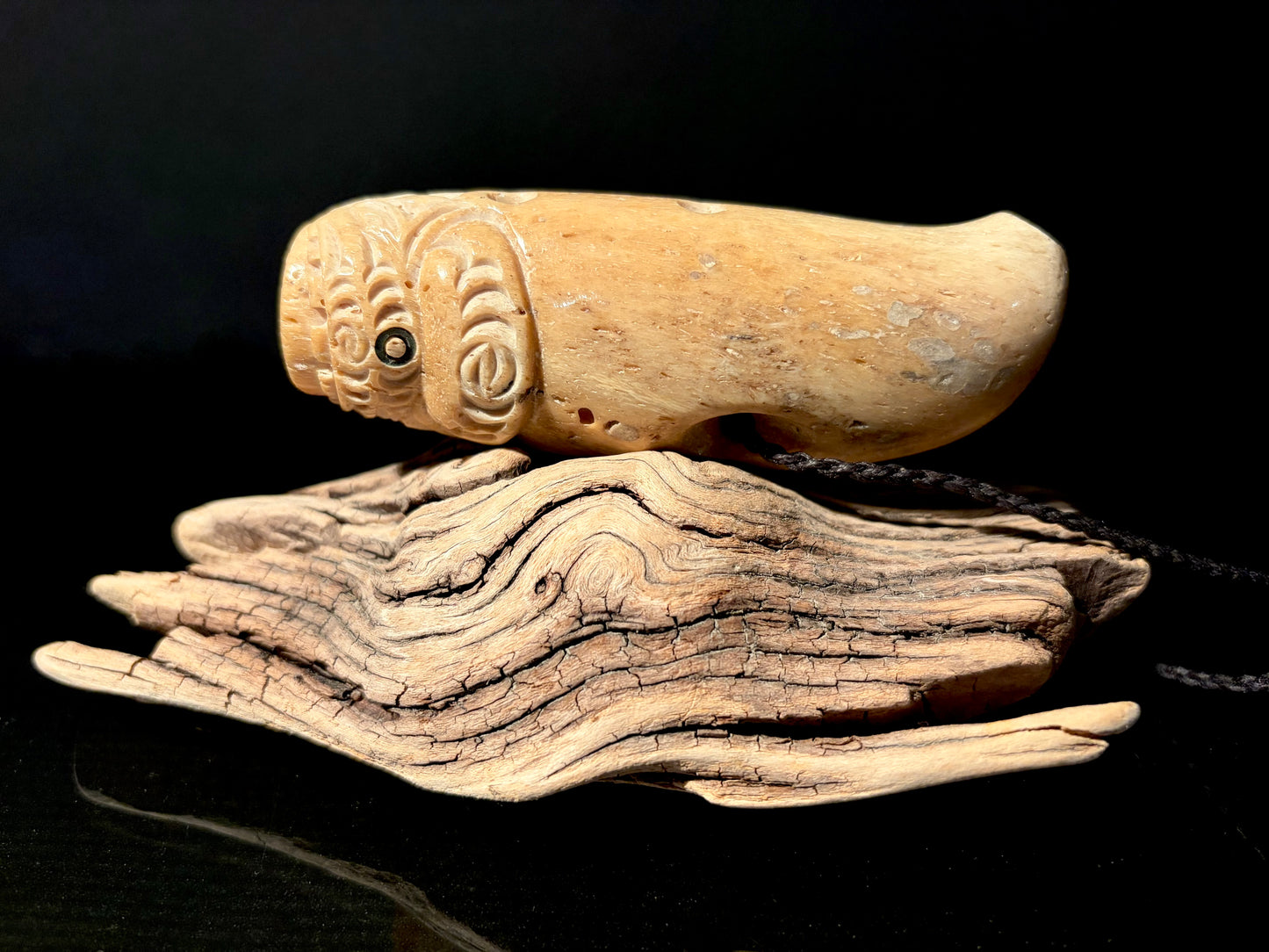Carved Nguru (flute) Parāoa (sperm whale jawbone) by Alex Sands