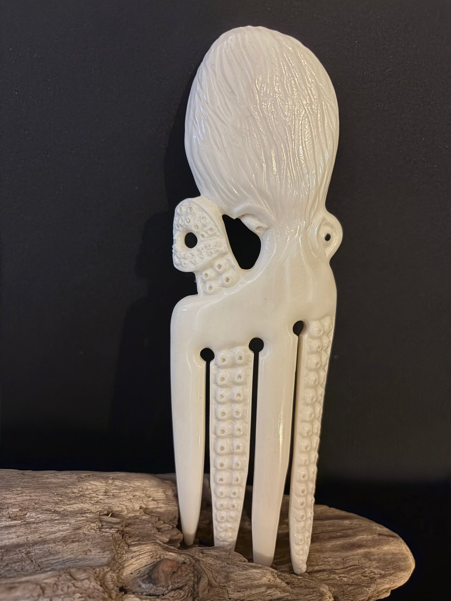 Carved Octopus Bone Heru by Alex Sands