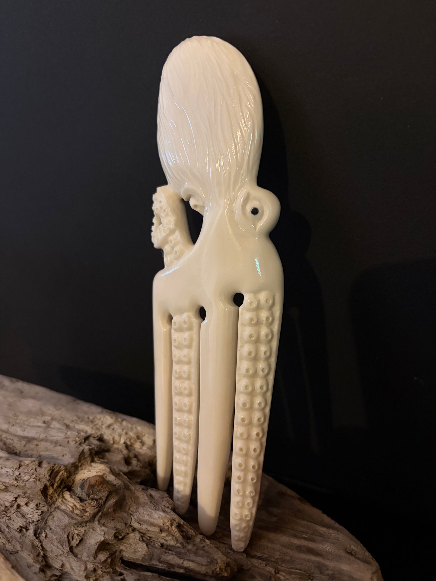 Carved Octopus Bone Heru by Alex Sands
