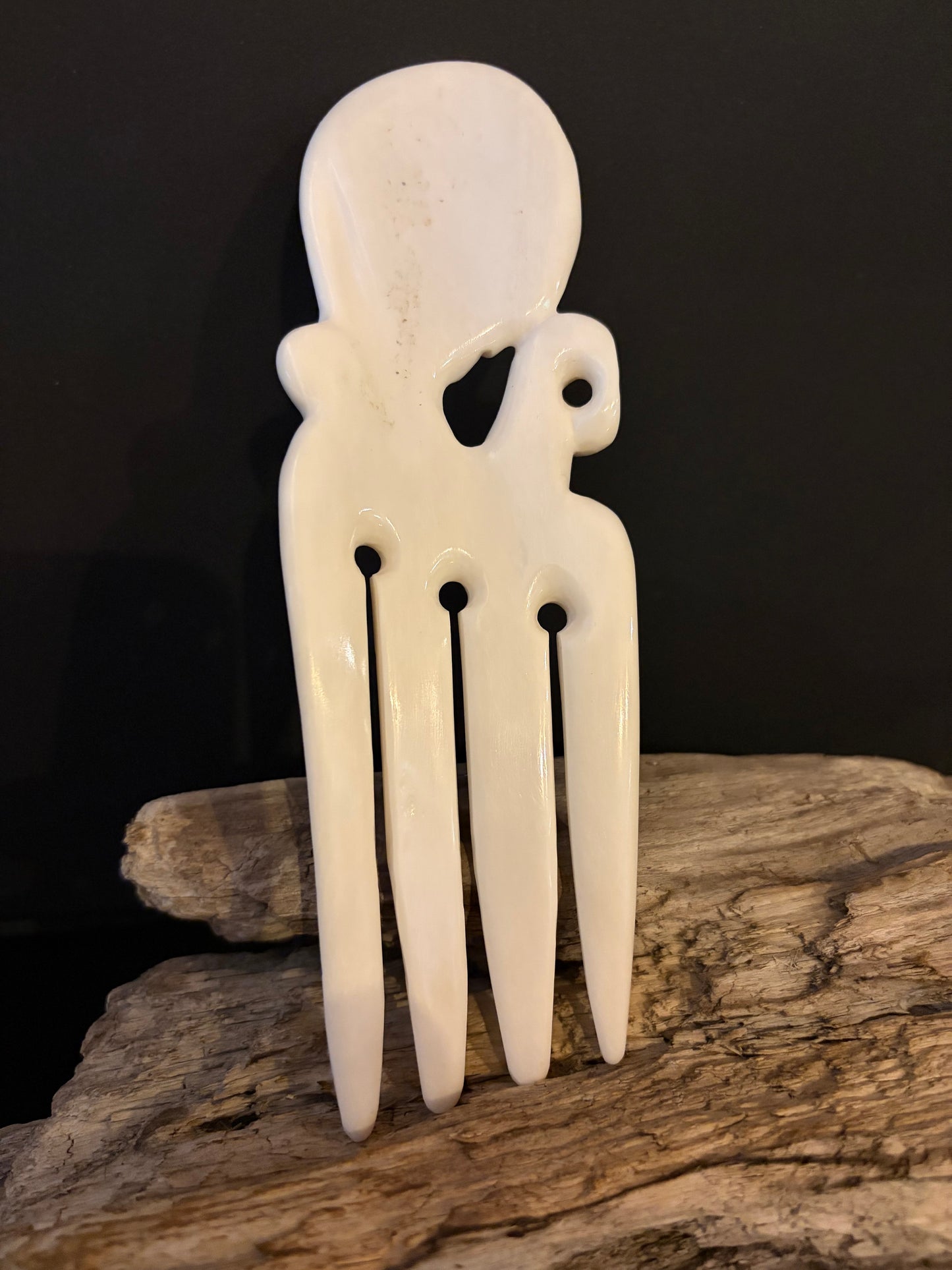 Carved Octopus Bone Heru by Alex Sands