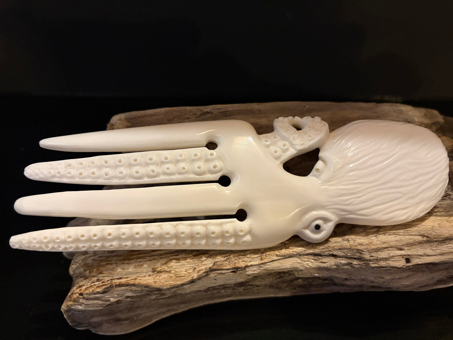 Carved Octopus Bone Heru by Alex Sands