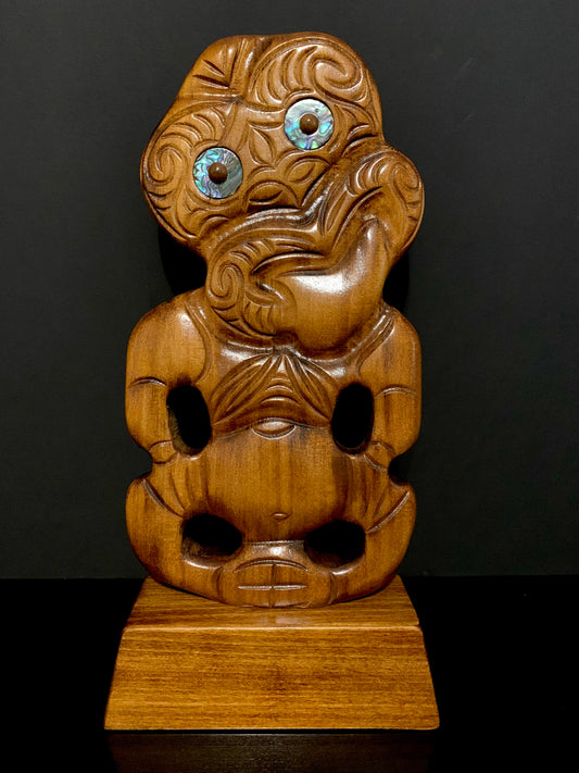 Maori small tiki on stand carved in New Zealand and available from Silver Fern Gallery
