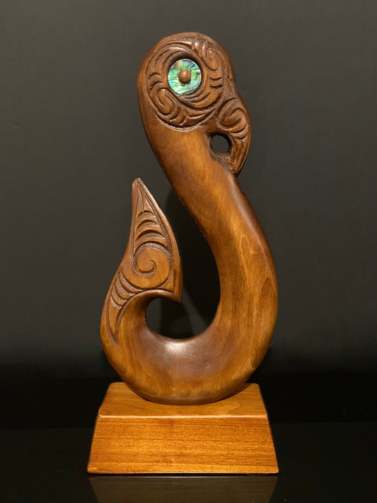 reverse of matau fish hook on base by Wood Masters available from Silver Fern Gallery
