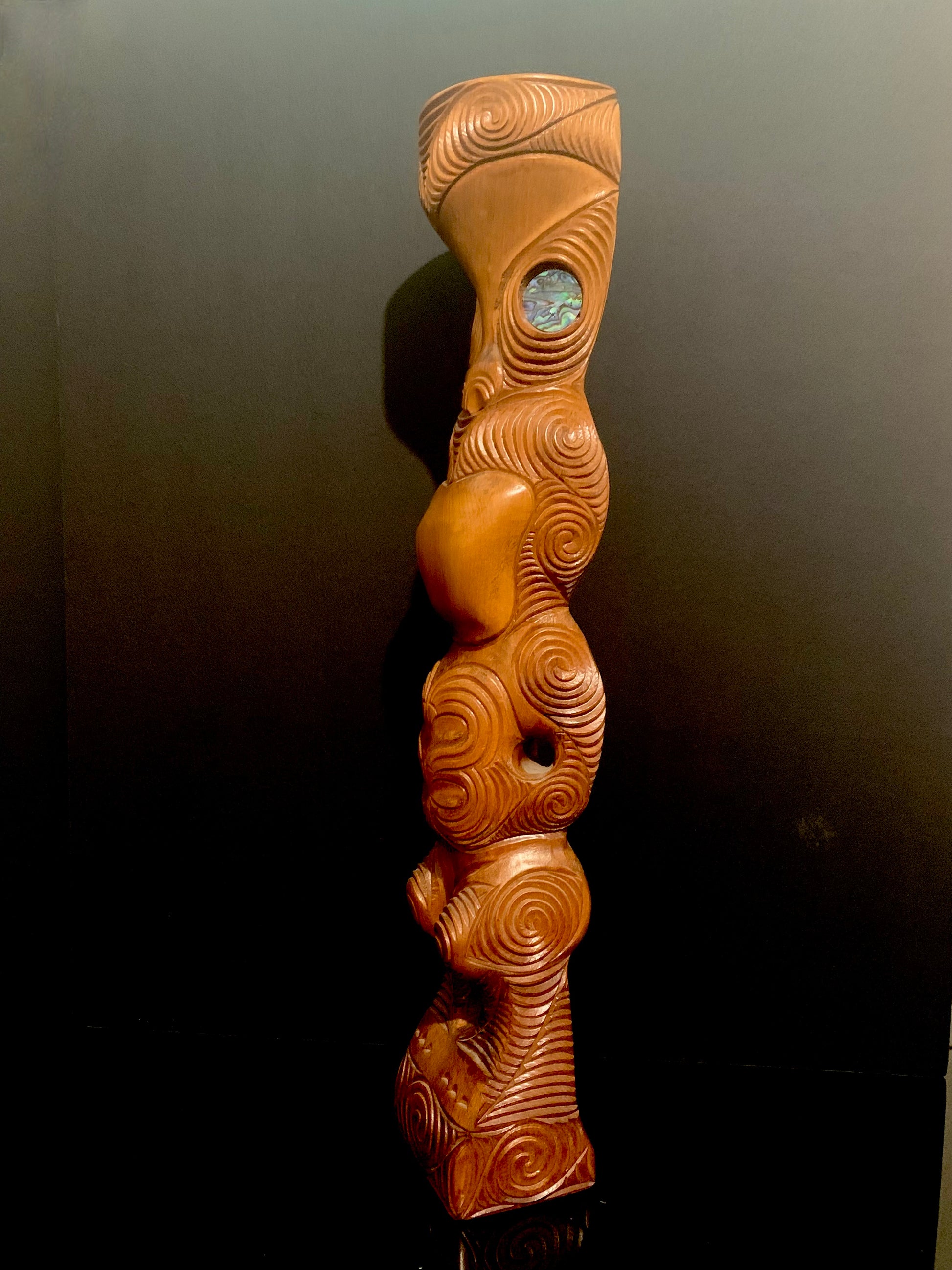 side view of Maori teko teko statue carved in New Zealand and available from Silver Fern Gallery