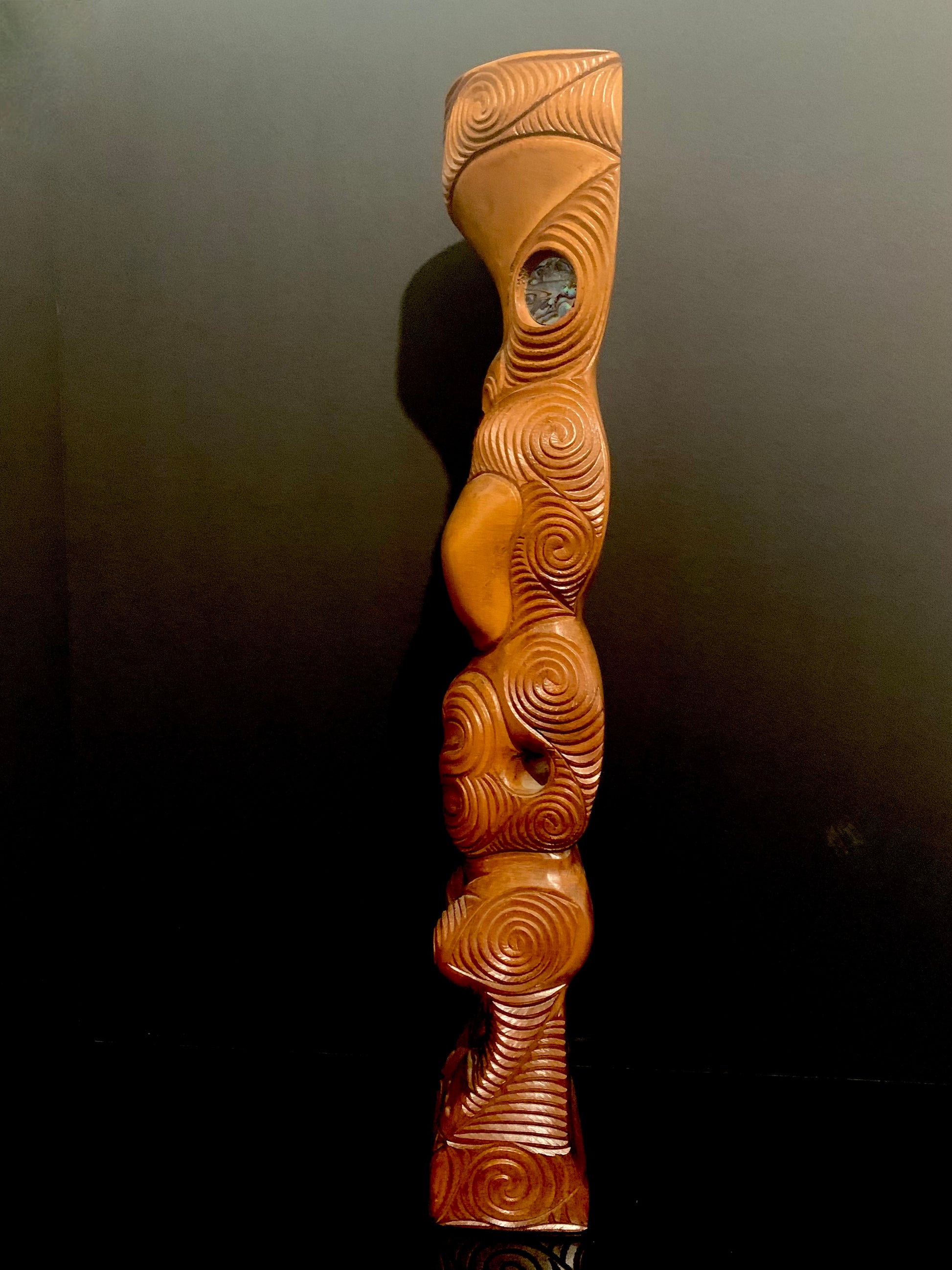 left side detail of Maori teko teko statue carved in New Zealand and available from Silver Fern Gallery