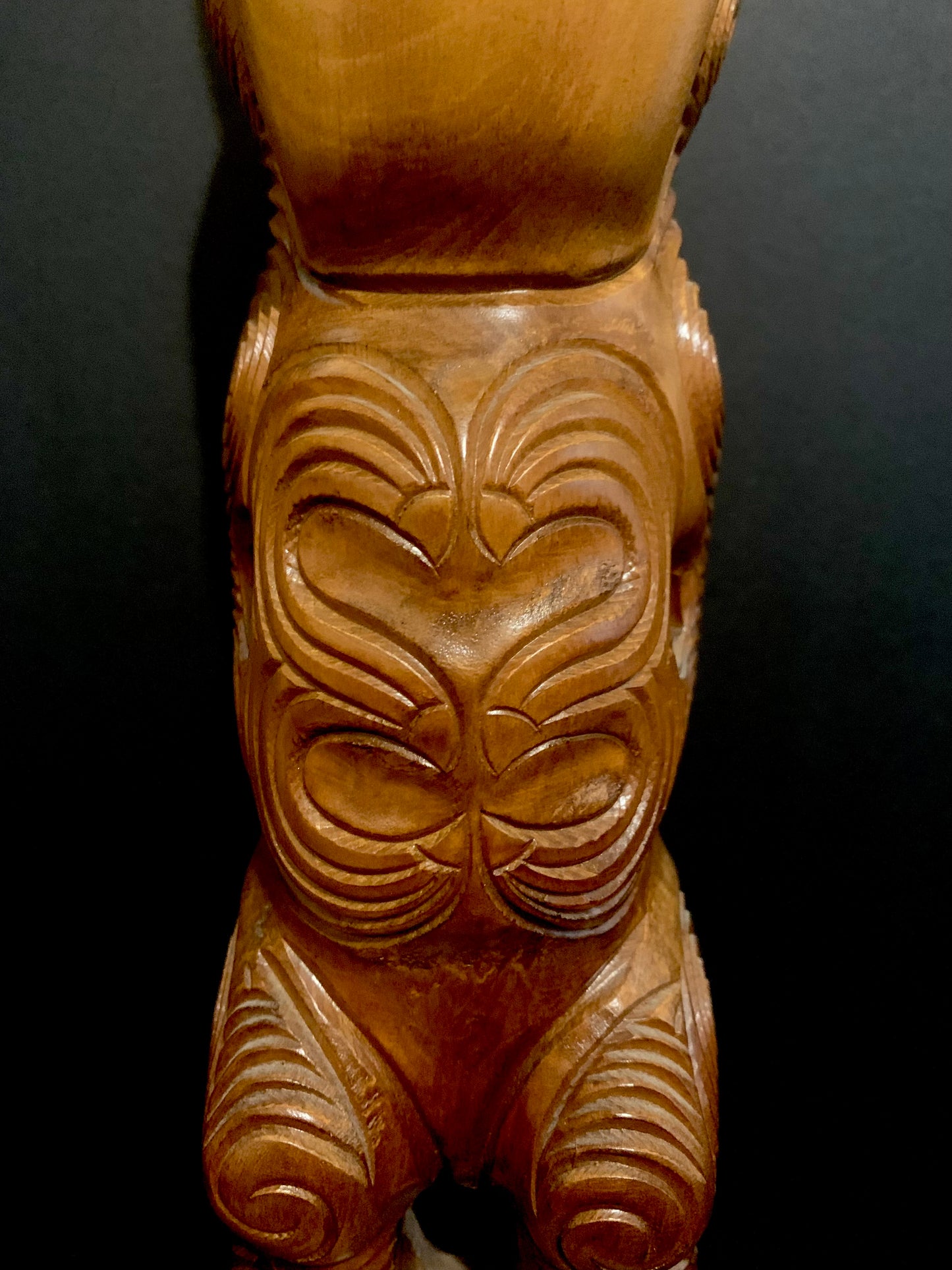 front detail of hands on Maori teko teko statue carved in New Zealand and available from Silver Fern Gallery