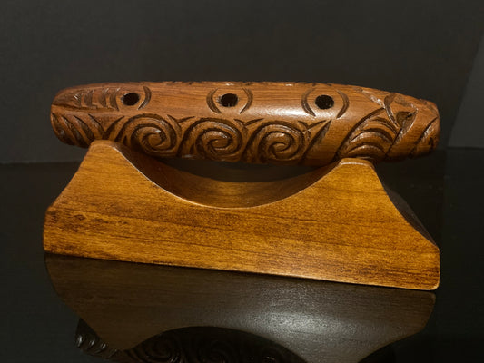 Carved Koauau (flute) with stand - by Wood Masters