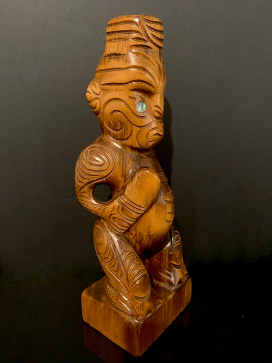 view looking to the right of Maori teko teko with patu carved in New Zealand by Wood Masters available from Silver Fern Gallery