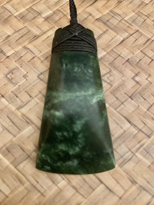 Maori Pounamu hei toki adornment from New Zealand available at Silver Fern Gallery