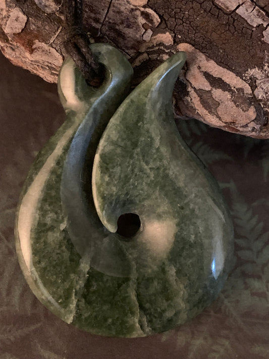New Zealand Maori hei matau greenstone adornment available from Silver Fern gallery
