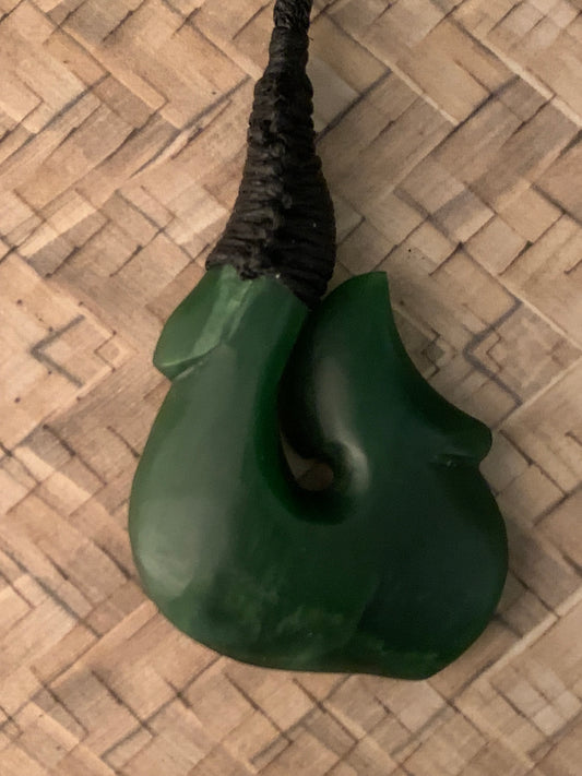 Maori made hei matau fish hook from New Zealand Pounamu greenstone jade