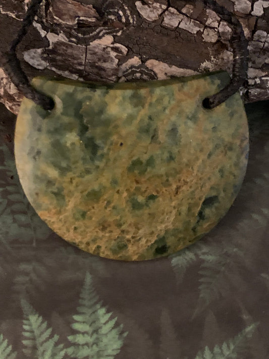 reverse of New Zealand Maori breast plate pounamu adornment available from Silver Fern gallery