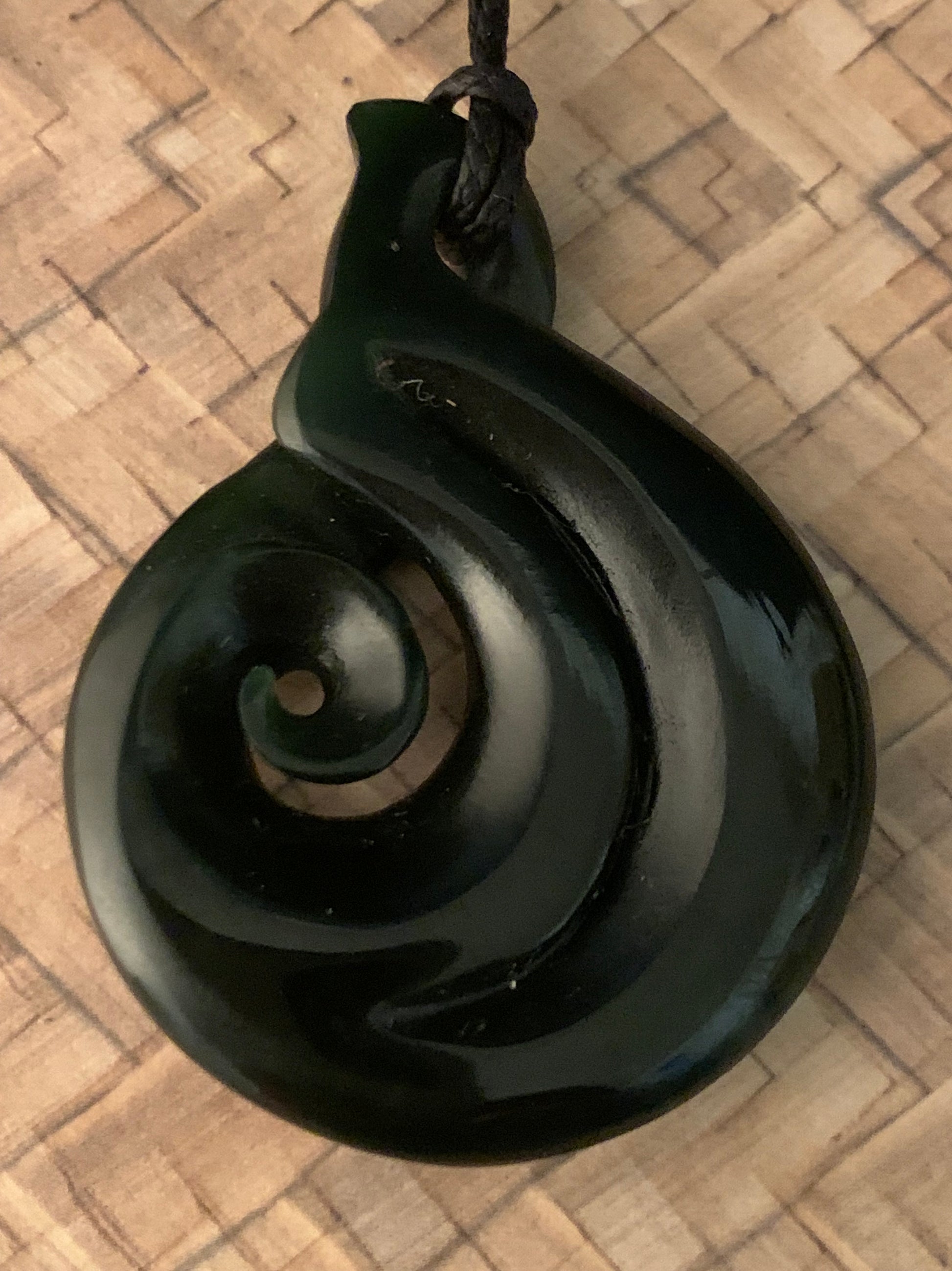 Pounamu koru pendant from New Zealand available from Silver Fern Gallery