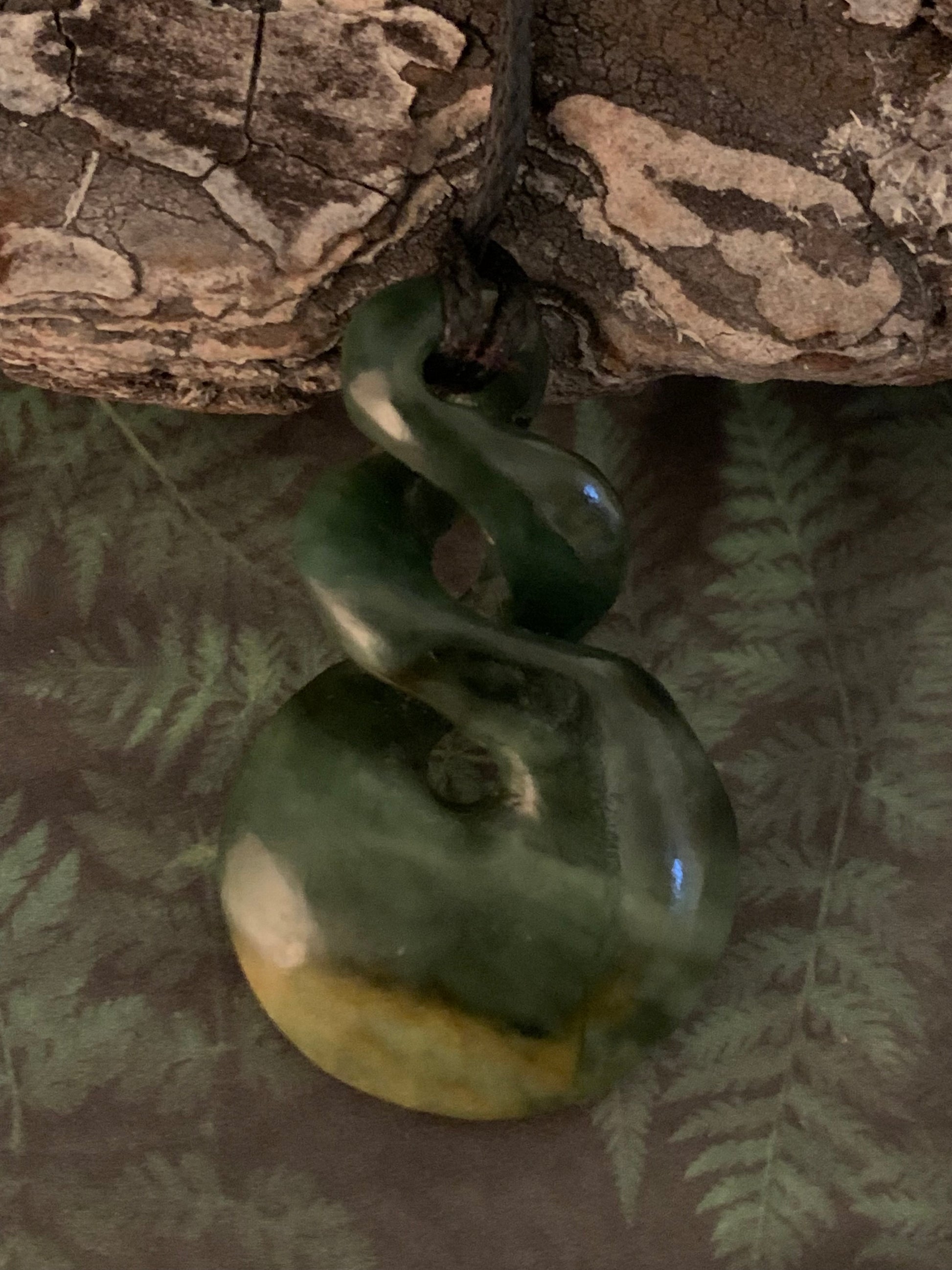 reverse of Maori Pounamu hei matau pendant from New Zealand available to purchase