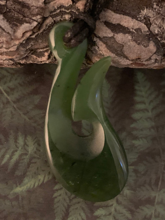 New Zealand Maori hei matau pounamu adornment available from Silver Fern gallery