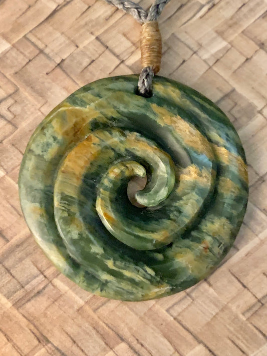 Pounamu koru pendant from New Zealand available to purchase