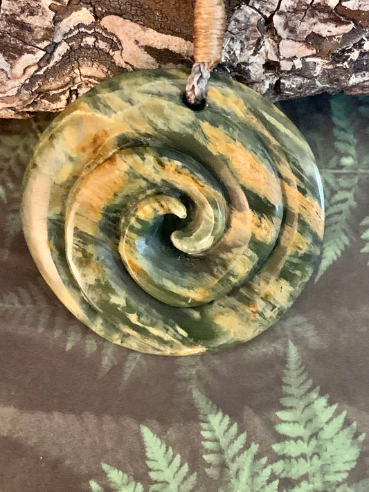 Elaborate Pounamu koru pendant from New Zealand available from Silver Fern Gallery