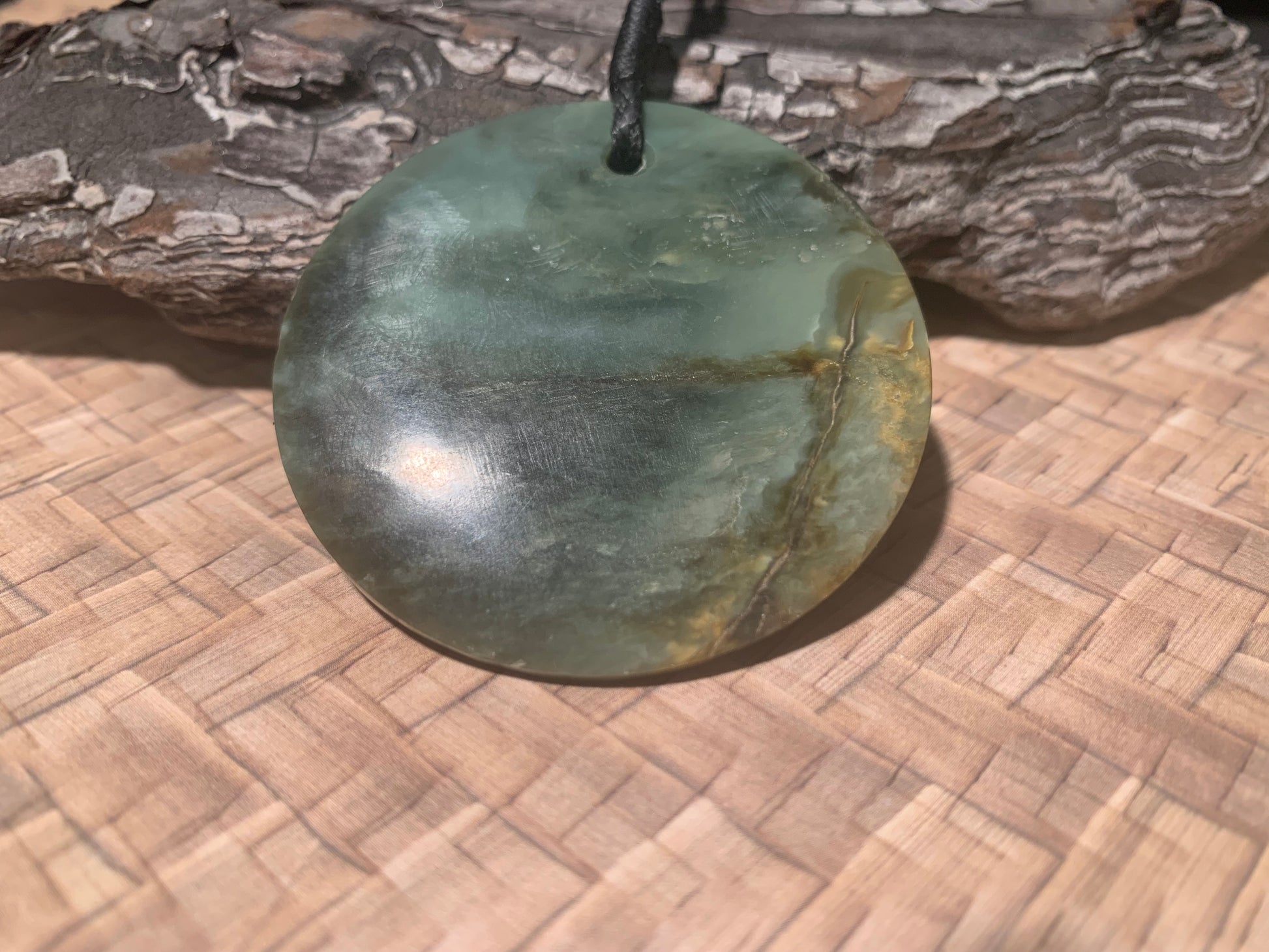 Pounamu Koru Porohita disc carved by Alex Sands 50mm