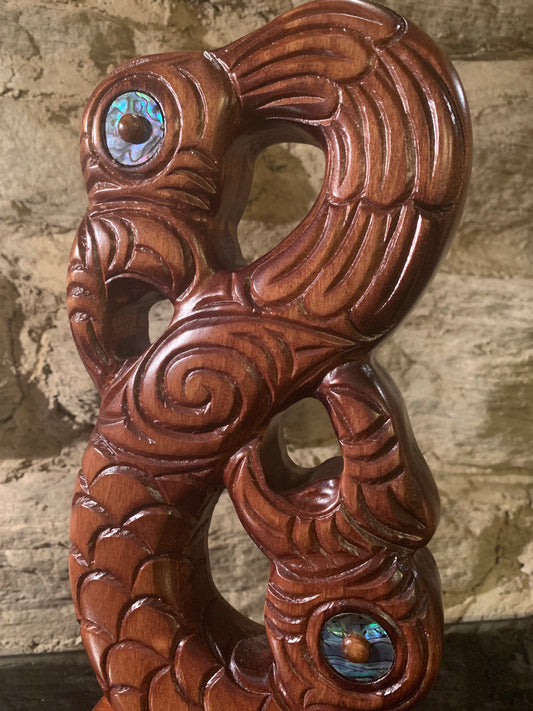 close up of Maori wood manaia on stand carved in New Zealand and available from Silver Fern Gallery