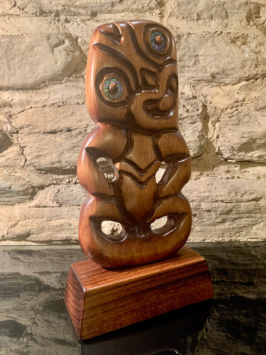 side angle of small Maori tiki carved in New Zealand and available from Silver Fern Gallery