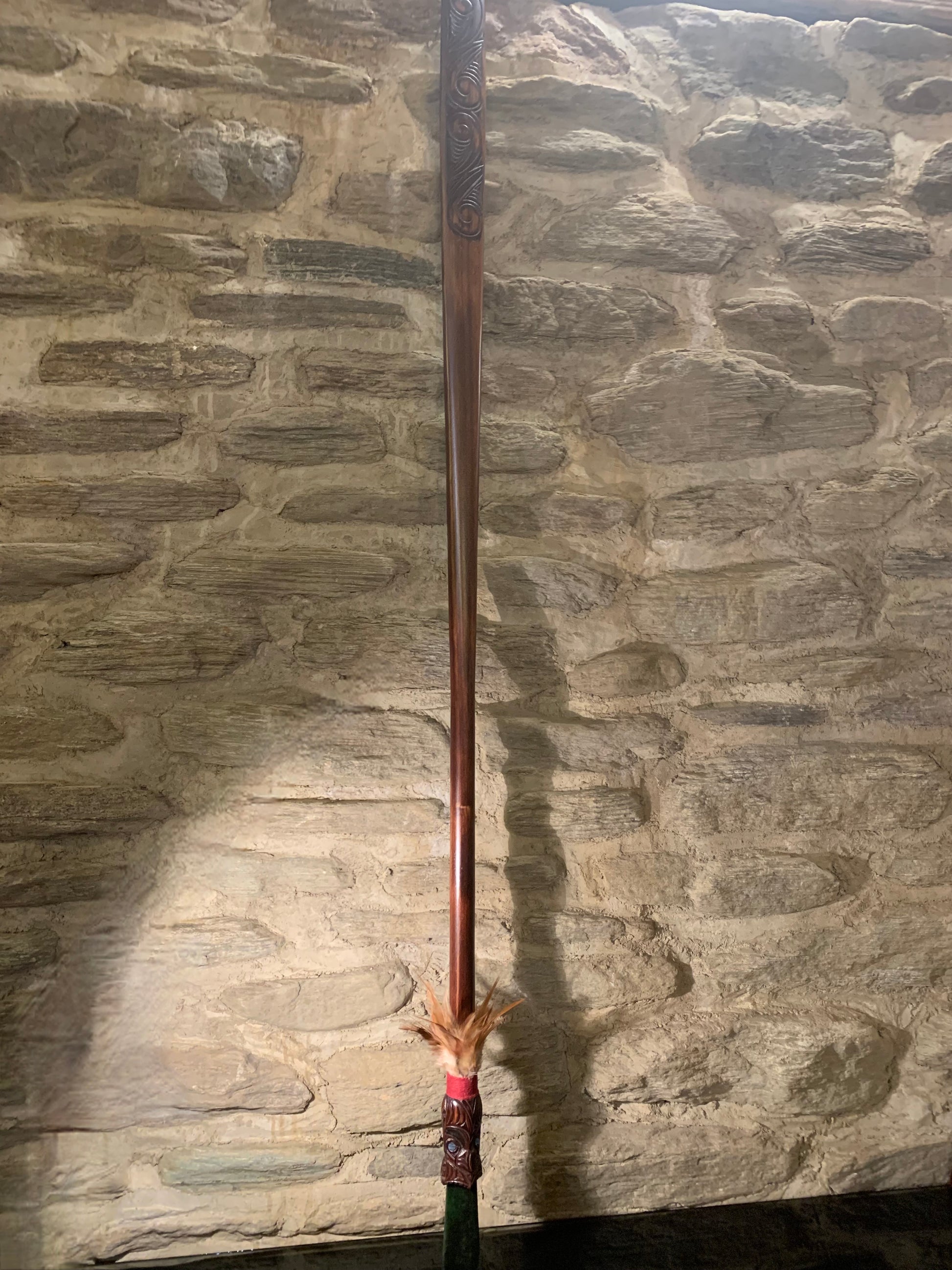 full view of Maori wood and pounamu taiaha weapon carved in New Zealand and available from Silver Fern Gallery