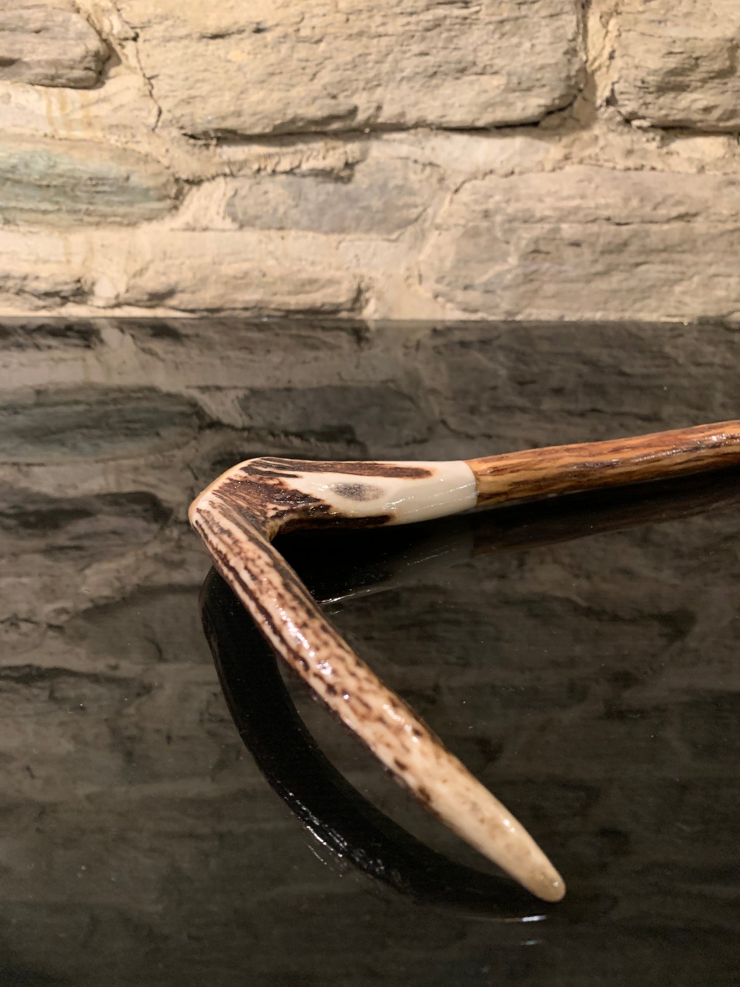 Handle of a walking stick made from deer antler and lancewood