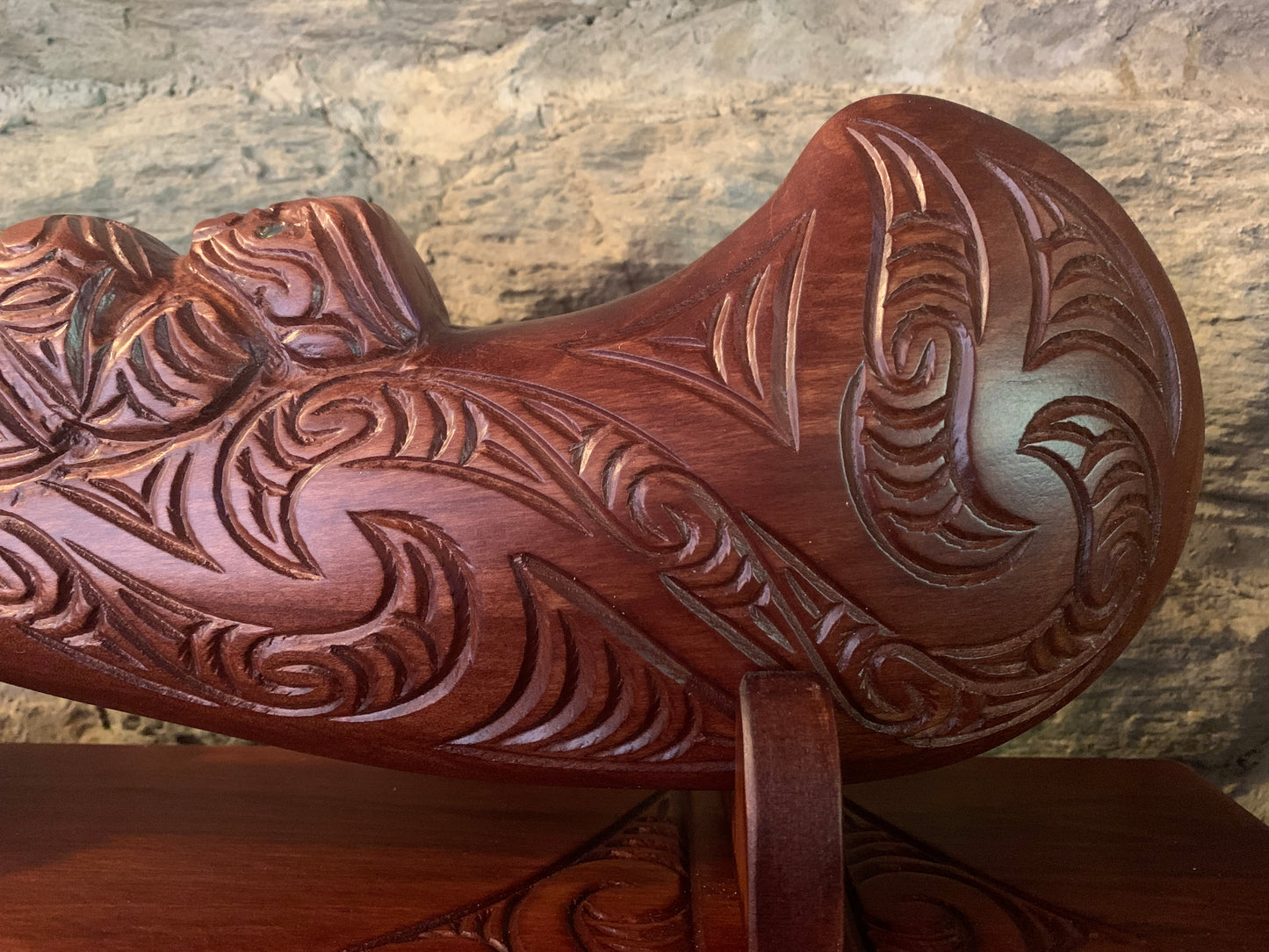 Intricate Maori carving on the blade of a wahaika 