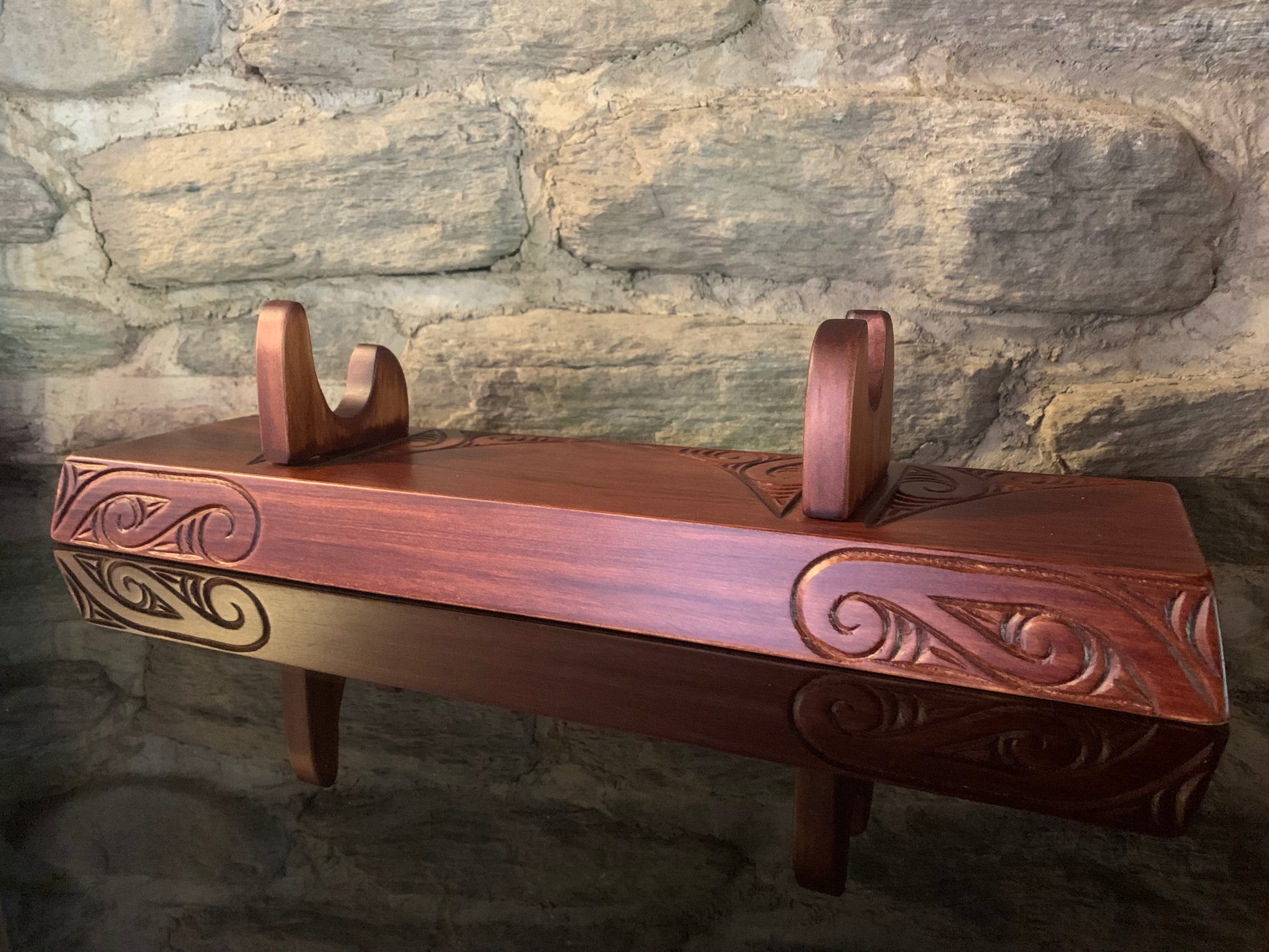 carved wooden Maori wahaika display stand