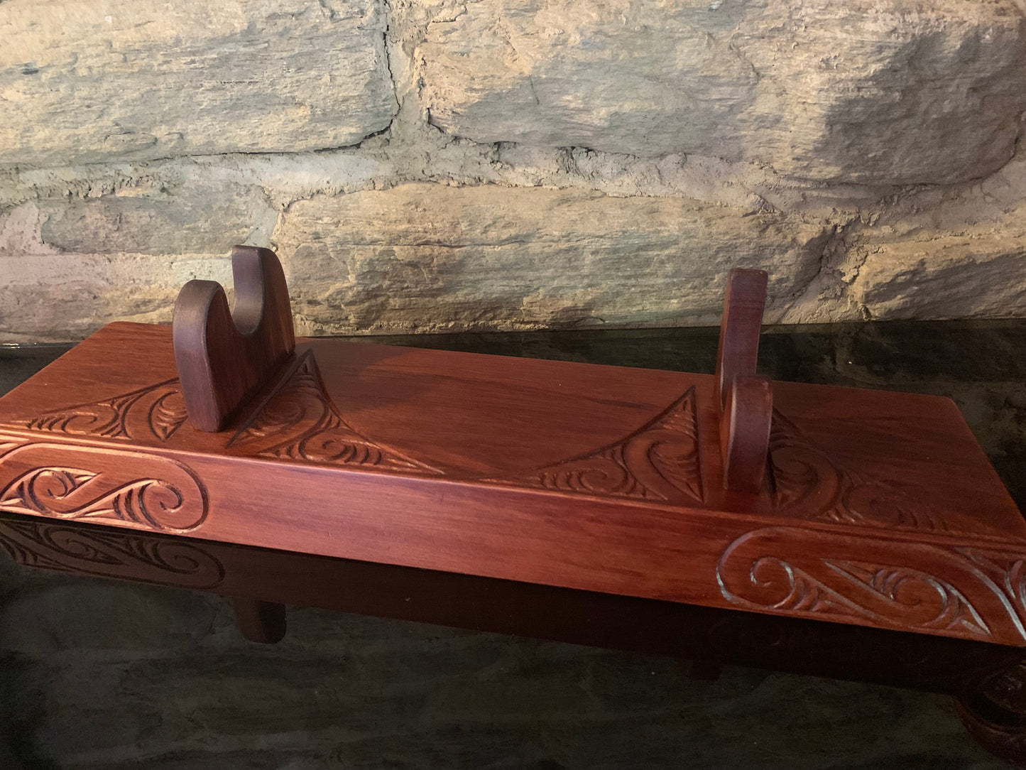 carved wooden stand for a Maori wahaika 