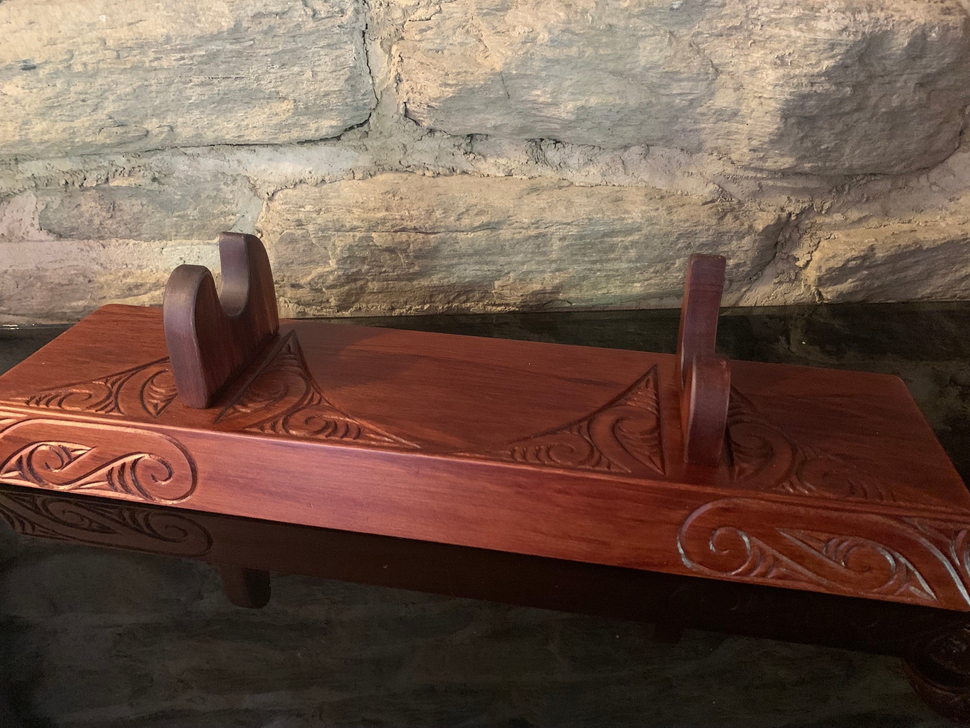 carved wooden stand for a Maori wahaika 