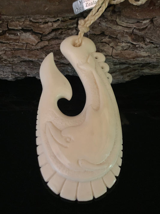 Bone Dolphin Hei Matau Pendant - by Norman Clark