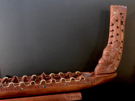 Carved Waka Taua on stand - by Wood Masters