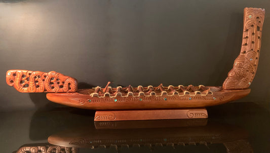 Carved Waka Taua on stand - by Wood Masters