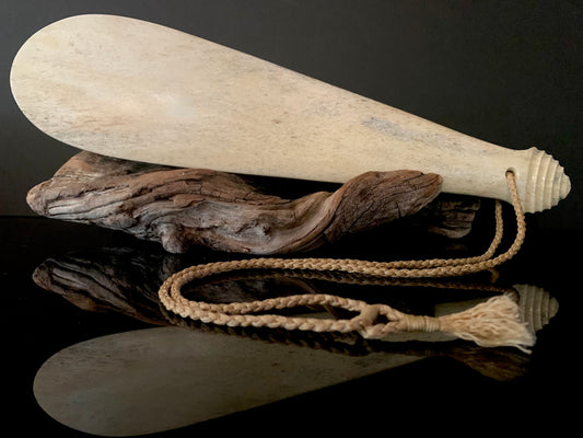 weapon made from whale bone carved in New Zealand by Maori 