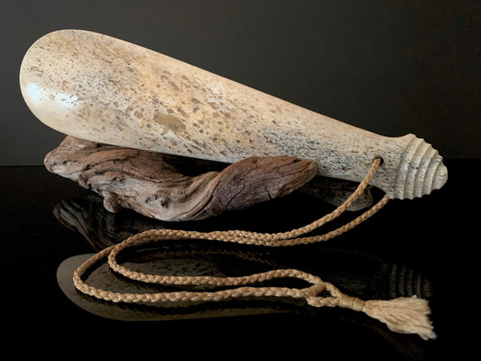 maori weapon patu made from whale bone and carved in New Zealand
