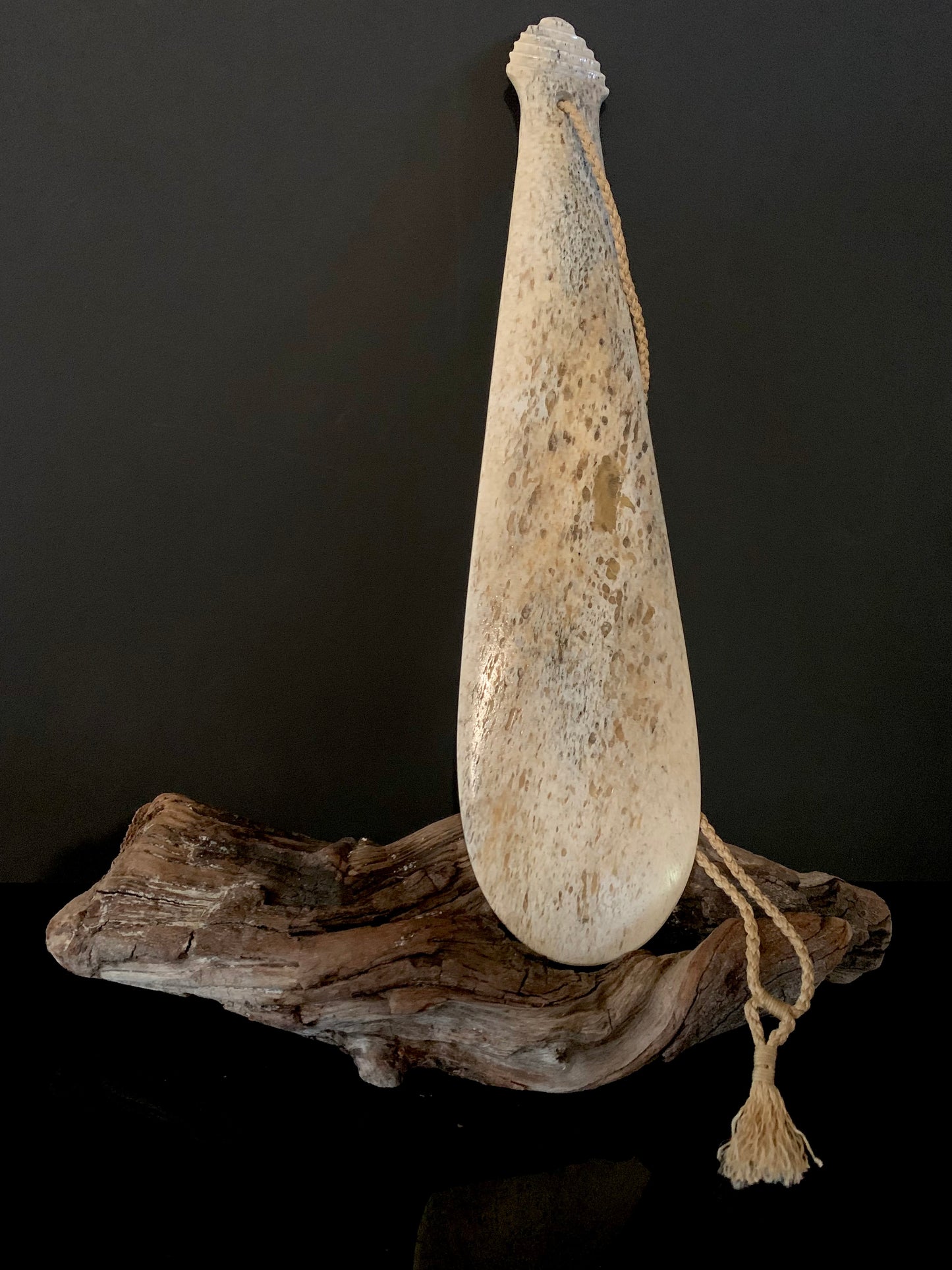 reverse side of maori weapon patu carved from whale bone 