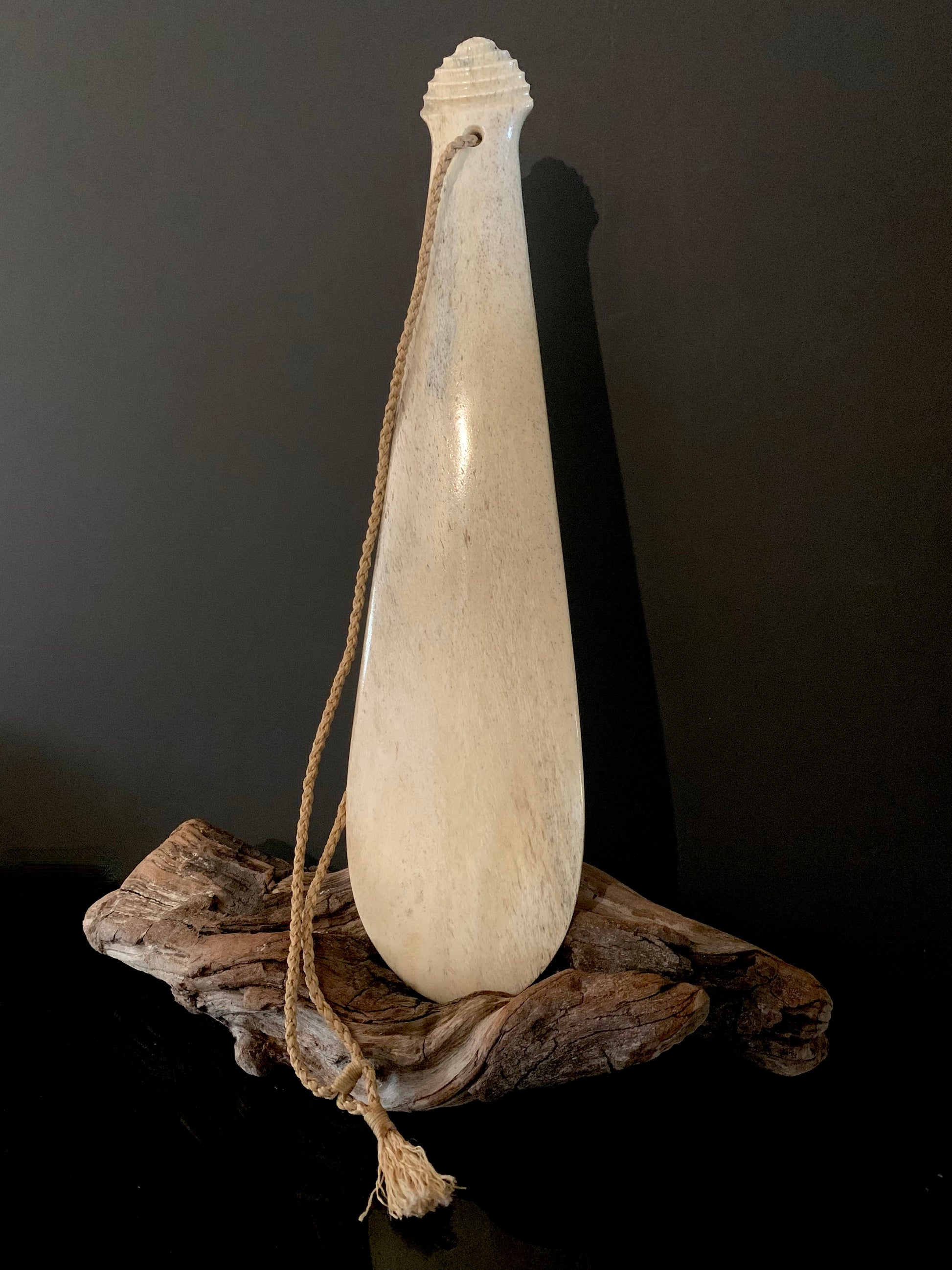 photo showing whale bone maori patu weapon 