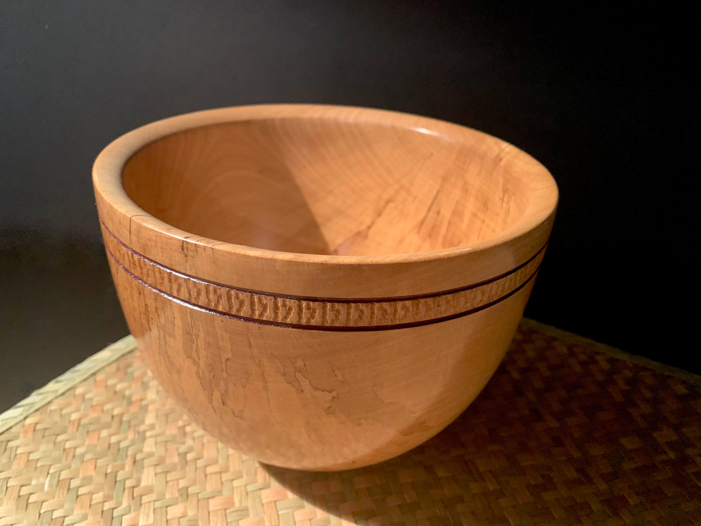 Wooden bowl with hand tooled detailing on the outer.