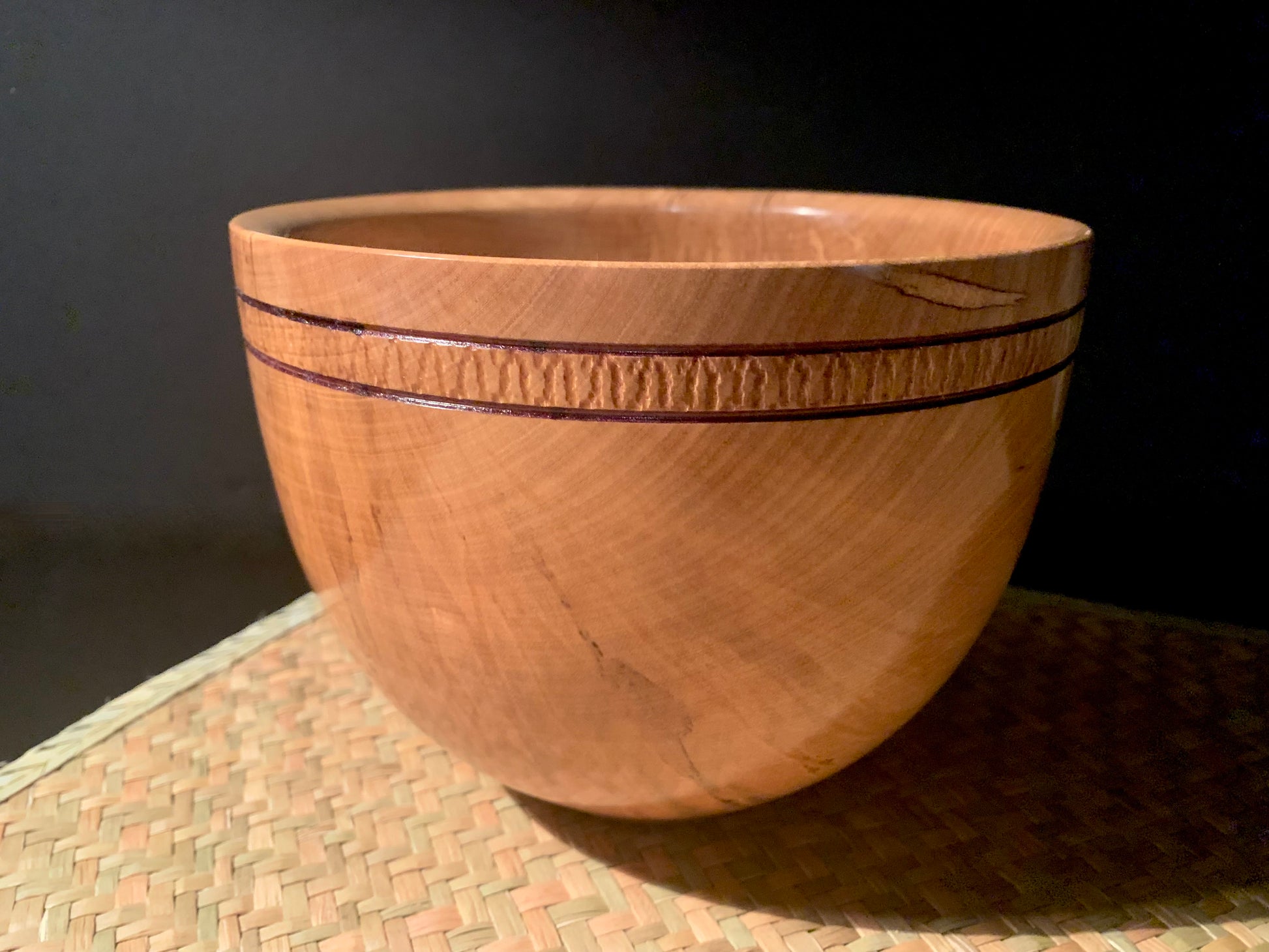 Wooden bowl with decorative banding.