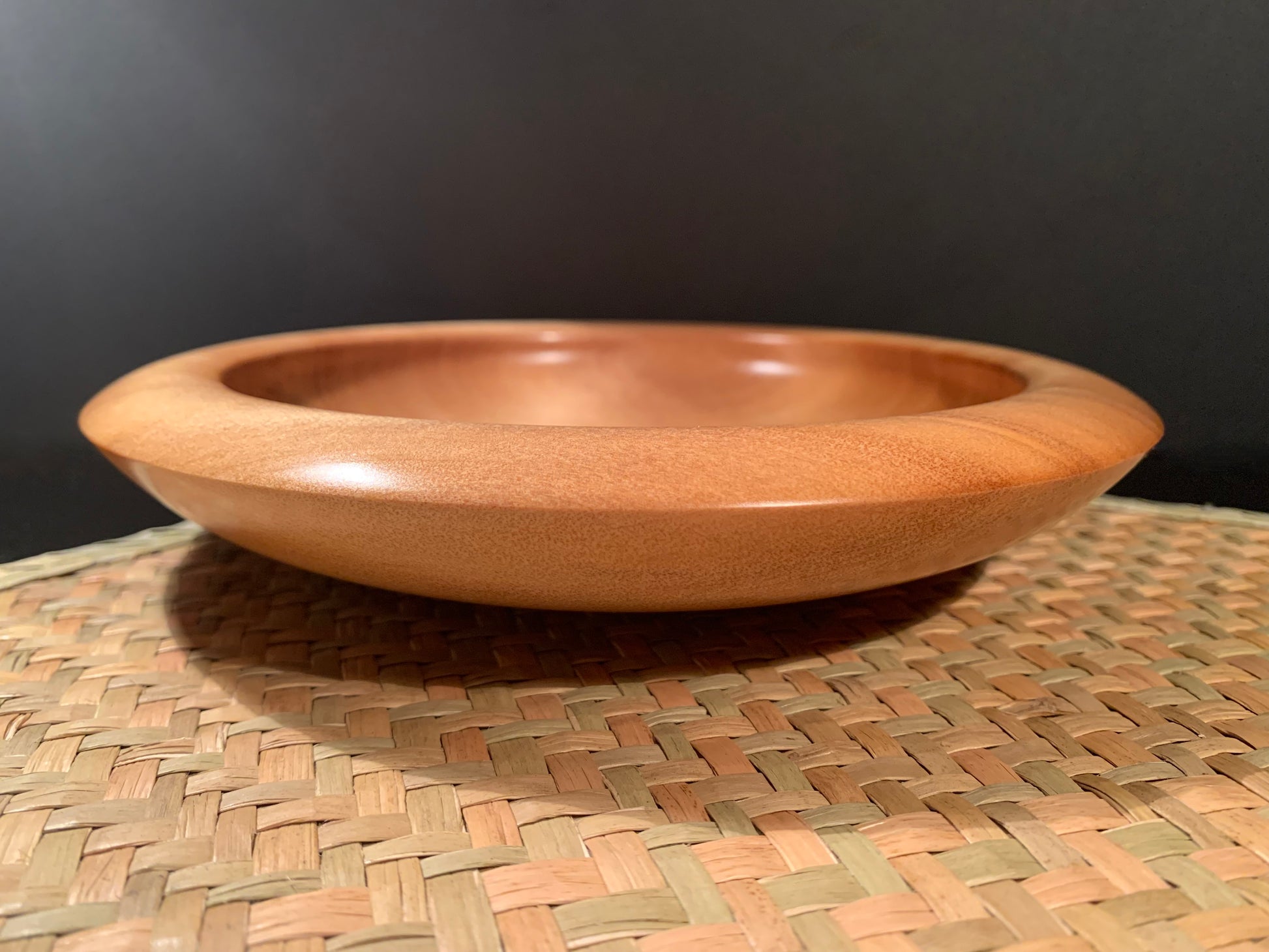 Wooden bowl with bevelled edge and matt satin oil and wax finish.