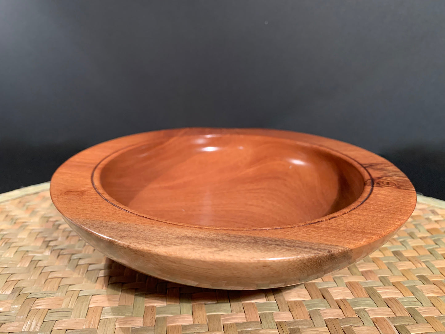 Wooden bowl with colour change feature on the side of the bowl.