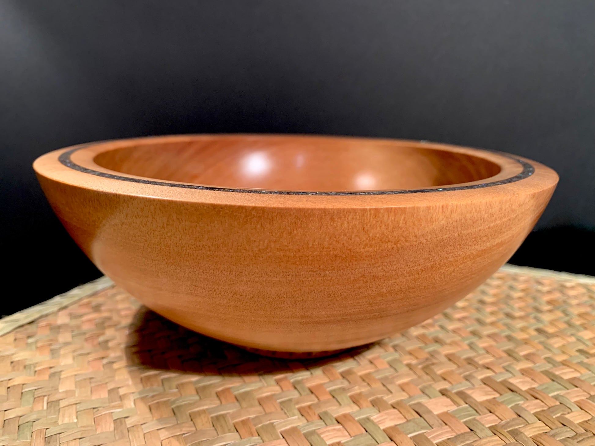 Wooden bowl with paua shell inlay in the rim for added feature.