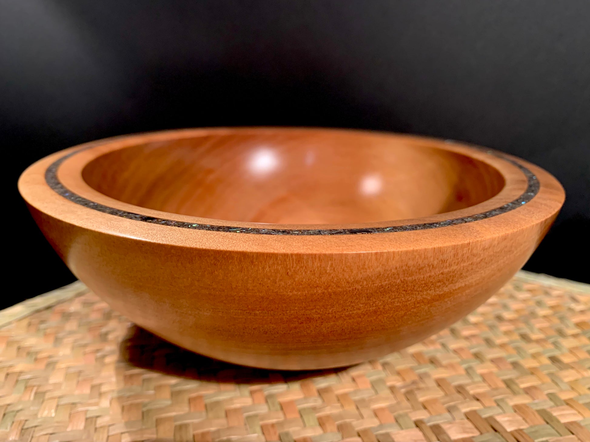 Wooden bowl with New Zealand Paua Shell feature in the rim.