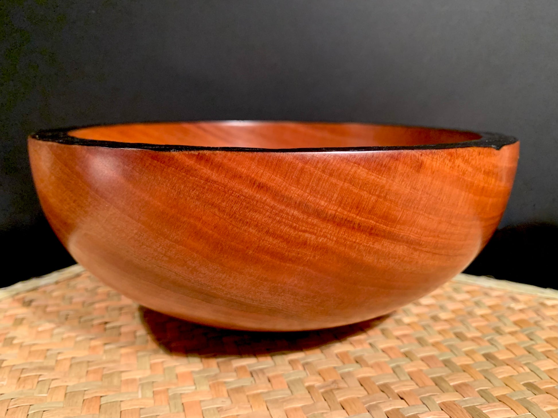 Wooden bowl with feature dark rim. 