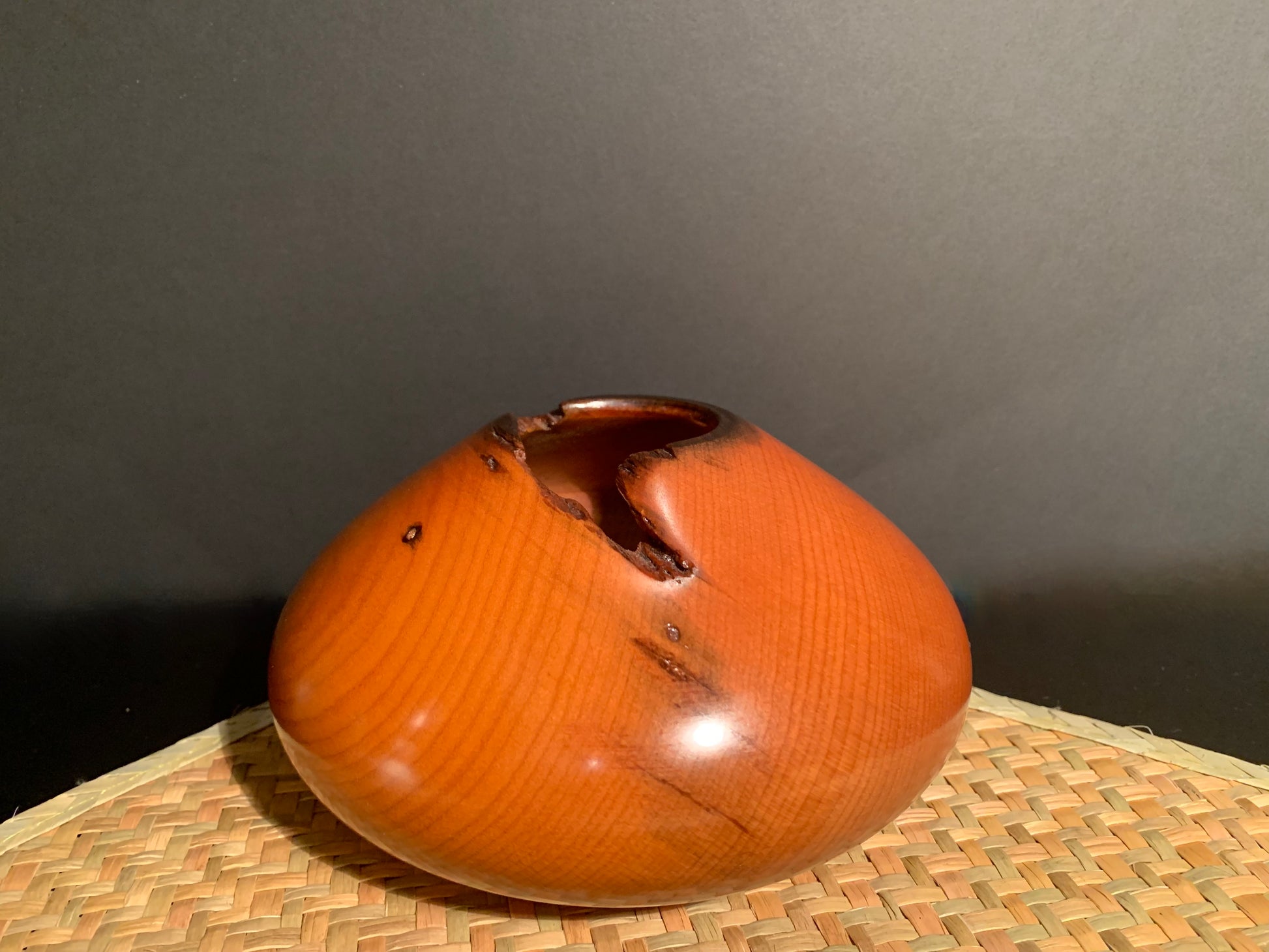Classical conical shaped vase with a natural orifice feature.