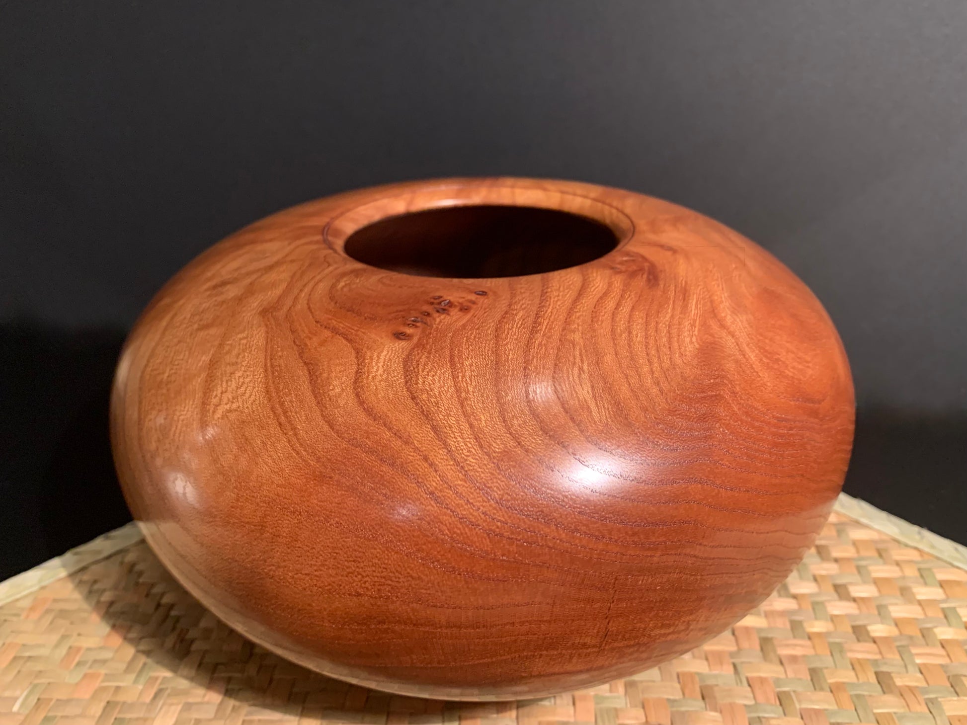 Round classic wood turned  urn with small oriifice. 
